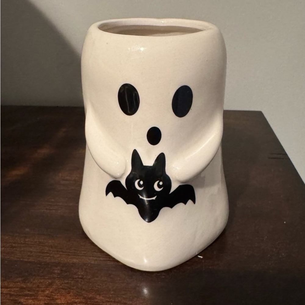 New! Halloween ghost holding a bat candle